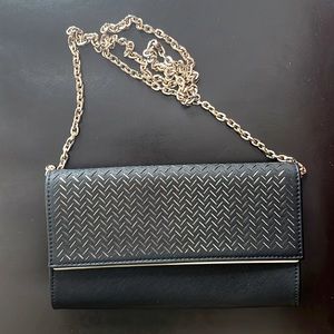 Madison West black and gold classy clutch purse.